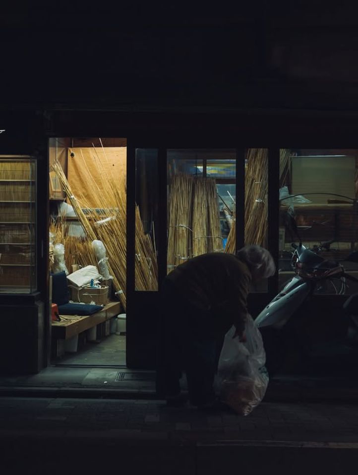 A shop being closed up for the night.